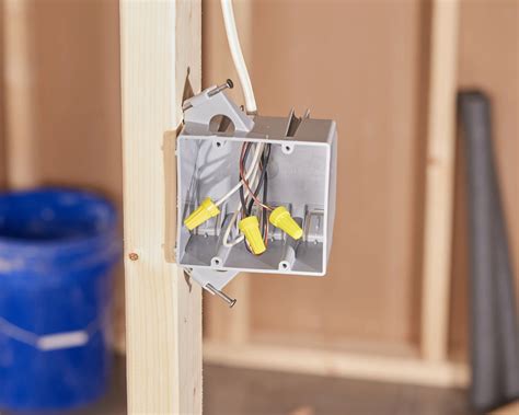 attaching electrical outlet box to metal framing|attaching metal box to garage post.